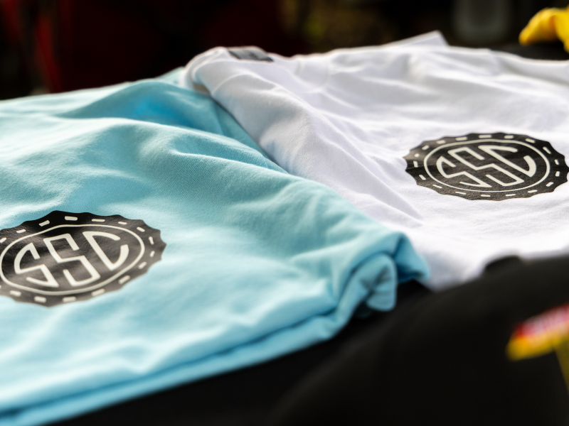 Screen-printed SSC monogram tees in blue and white